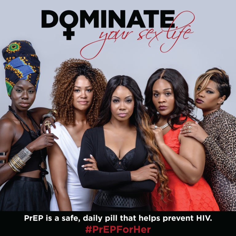 Against a grey background, five fierce women of color stand in black, white, red, and leopard-print formal wear. Above them floats prominently the word dominate, its O the symbol of femininity, and cursive pink ‘your sexuality’ finishing the phrase. At the bottom, in small white text is “PrEP is a daily pill that can prevent HIV,’ and in red ‘#PrEPforHer.’